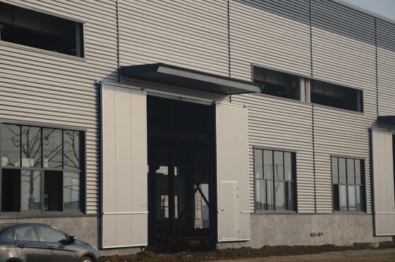 Q235B Prefabricated Steel Frame Building System Construction for Commercial Warehouse Fast Assembly Minimal Maintenance